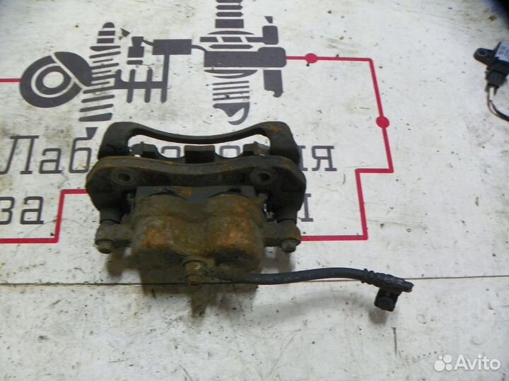 Суппорт тормозной передний левый Kia Sorento