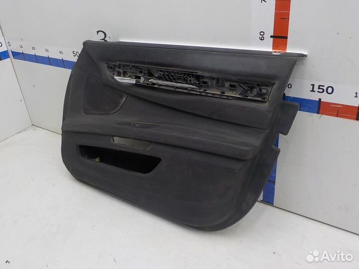 Обшивка двери передней правой на BMW 7