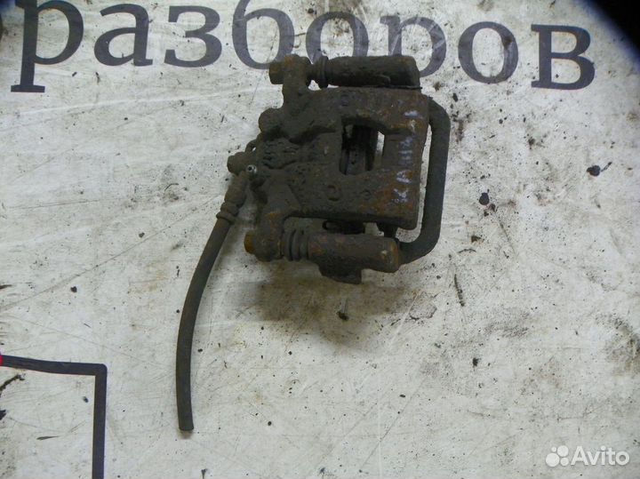 Суппорт тормозной задний левый Nissan Qashqai