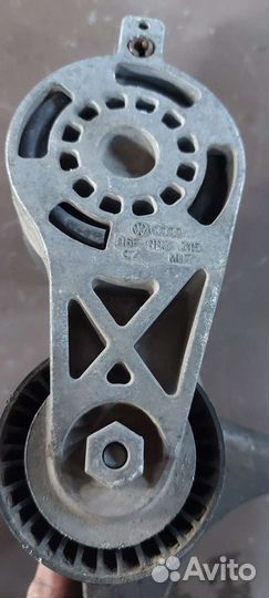 Натяжитель ремня на Volkswagen Passat B6