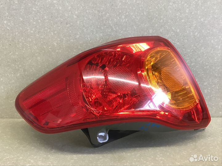 Фонарь задний наружный левый Toyota Corolla E15 20