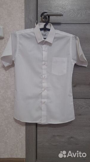 Рубашка с коротким рукавом,длина по спинке 66 см