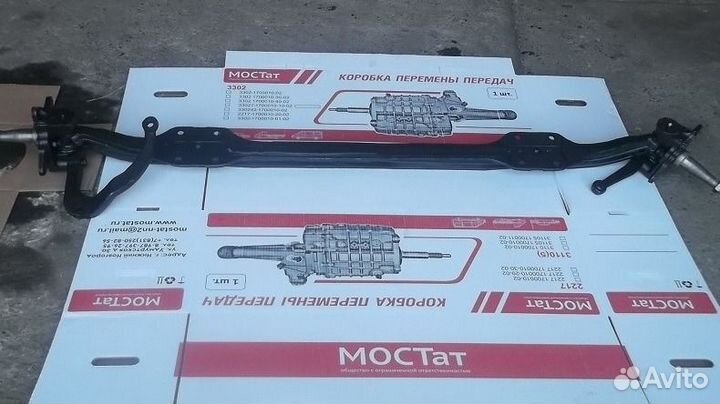 Балка передней оси в сборе с поворотными кулаками