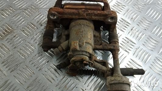 Суппорт тормозной задний левый opel astra J (NEA25