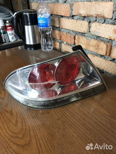 Фонарь левый лансер 9