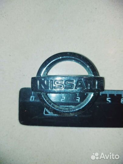 Эмблема Nissan