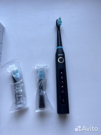 Электрическая зубная щетка
