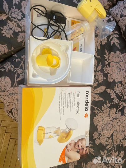 Молокоотсос medela электрический