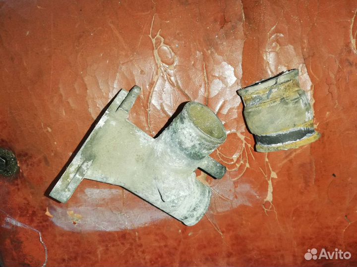 Патрубок отводящий Нива Шевроле