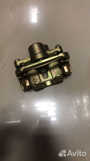 Суппорт тормозной Chery Tiggo задний левый 2WD (Ch