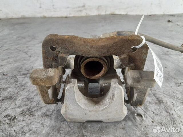 Суппорт тормозной задний левый Toyota Camry 50 55