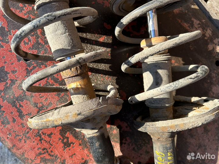 Передние стойки на mitsubishi lancer 9