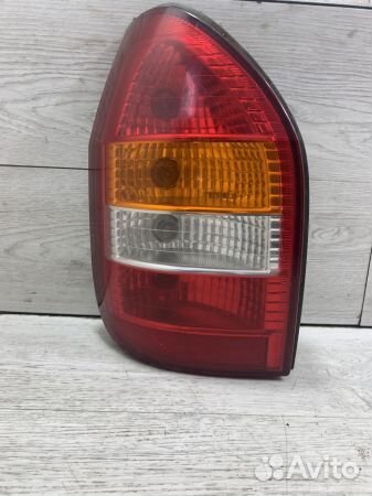 Фонарь задний левый Опель