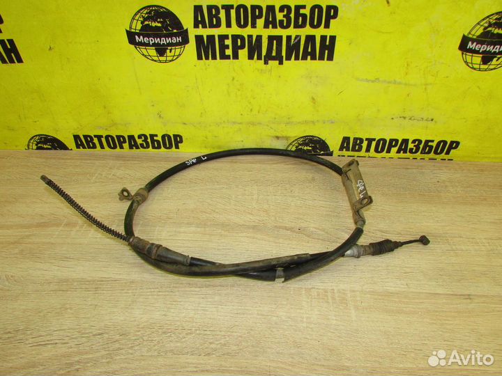 Трос стояночного тормоза левый на Kia Spectra SD