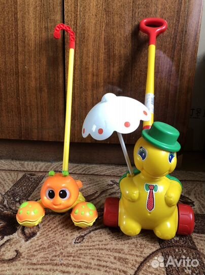 Игрушка каталка с ручкой