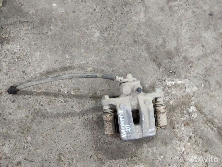 Kia Sportage 3 суппорт задний правый