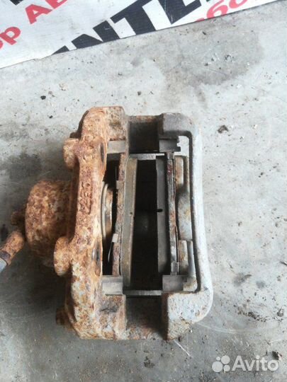 Суппорт передний левый Daewoo Nexia N150 1.5 2010