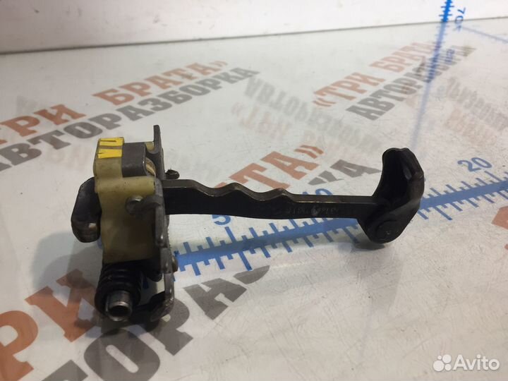 Рено Ограничитель открытия передней двери Лев