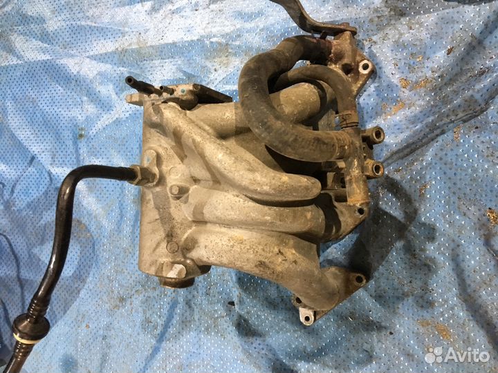 Запчасти на Шевроле Ланос впускной коллектор на Дв