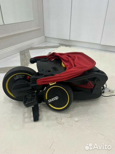 Детский велосипед с ручкой doona