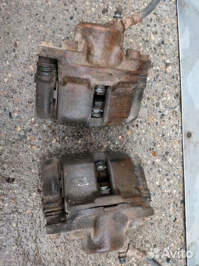 Суппорт тормозной передний Renault Logan седан K7J