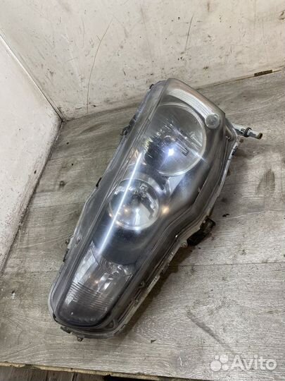 Фара левая Mitsubishi Lancer