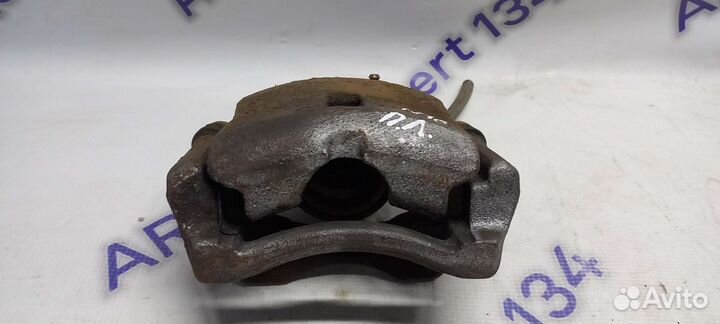 Суппорт передний левый Nissan Almera N16