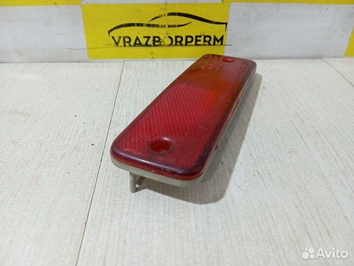 Отражатель в бампер задний левый Ssang Yong Musso