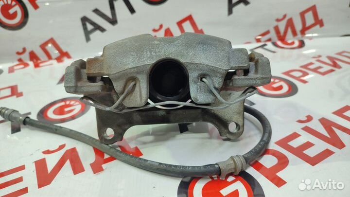 Суппорт тормозной передний левый Volkswagen Tiguan