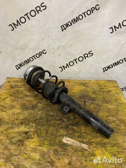 Стойка амортизатора передняя левая BMW E87