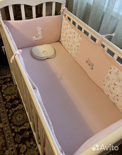 Детская кроватка с продольным маятником