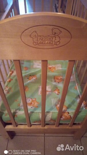 Детская кроватка с маятником и ящиком
