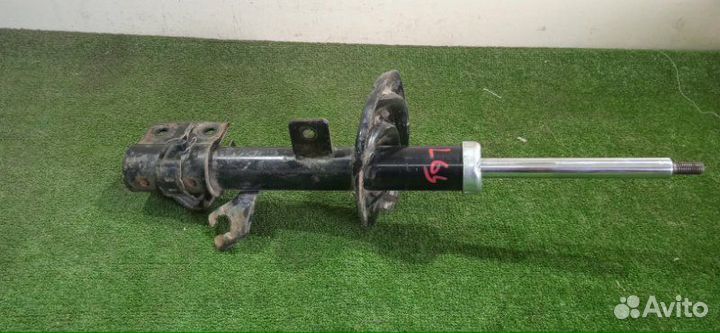 Амортизатор передний левый Nissan Micra K12E