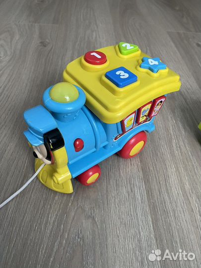 Игрушка каталка паровозик