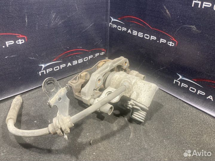 Суппорт тормозной задний левый mazda 3 bk