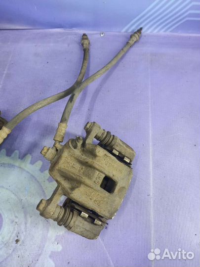 Суппорт тормозной задний Kia Sportage 2