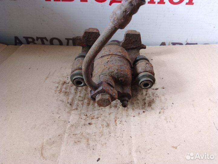 Суппорт тормозной задний правый Dodge Stratus 2.4