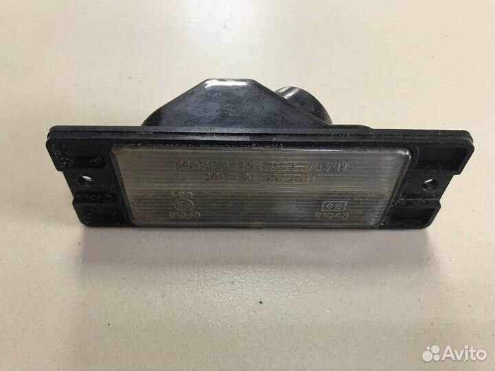 Фонарь подсветки номера Mitsubishi Pajero