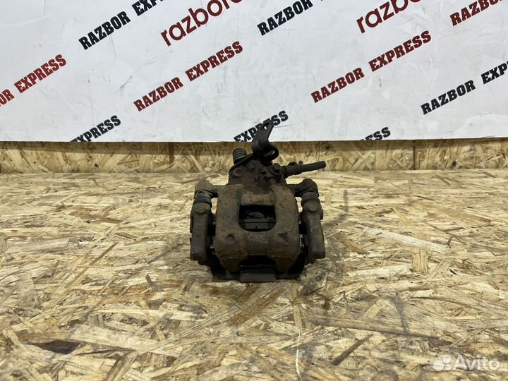 Суппорт тормозной задний левый Skoda Octavia A5