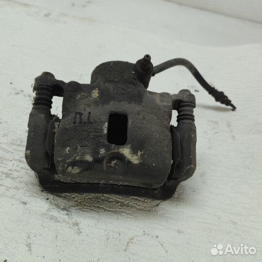 Суппорт тормозной передний левый Hyundai Lantra J1