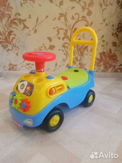 Машинка каталка музыкальная