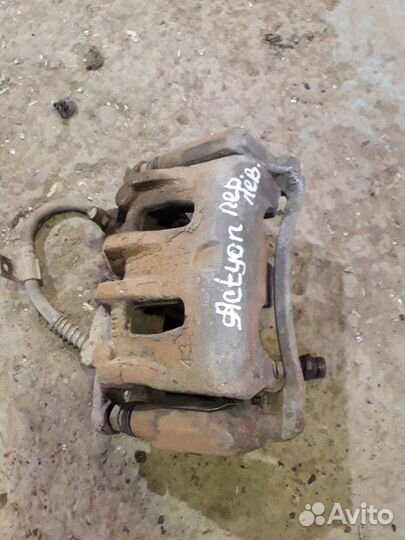 Суппорт тормозной передний Актион Нью Actyon New