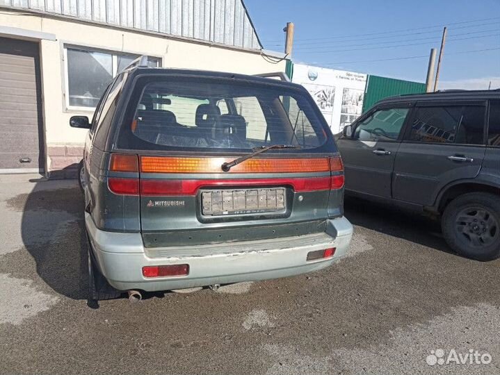 Замок двери передней правой Mitsubishi Space Wagon