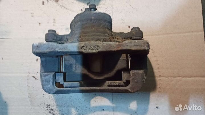 Суппорт тормозной передний Chevrolet Lacetti