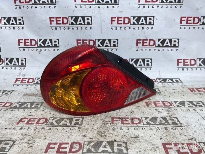 Фонарь задний левый задний левый Kia Spectra SD