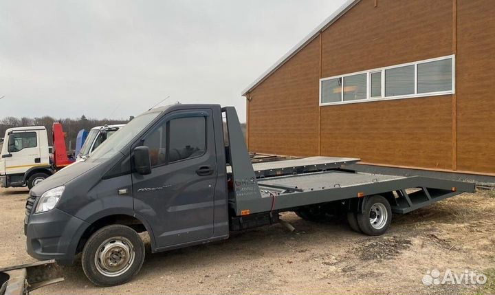 Эвакуаторная платформа ломаного типа