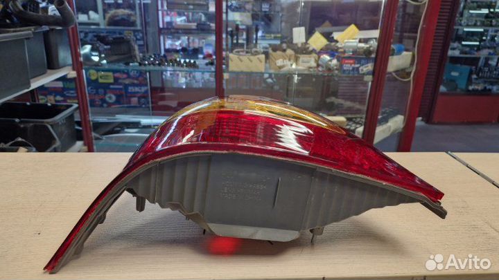 Фонарь задний задний левый Toyota Corolla NZE121