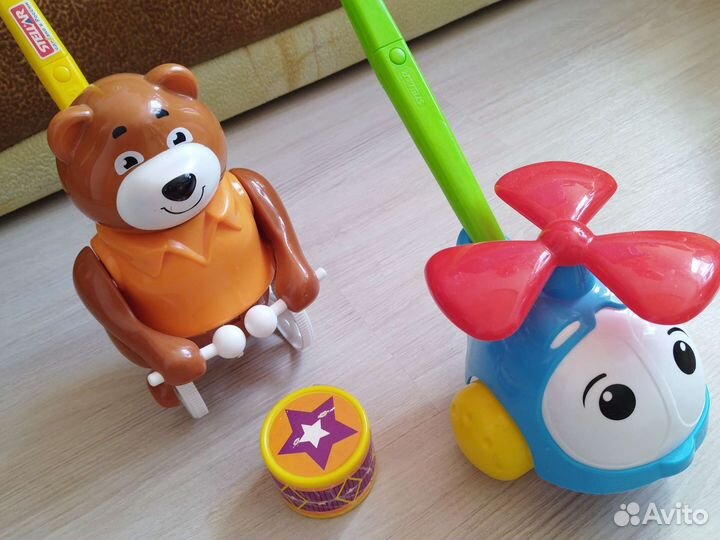 Игрушка каталка с ручкой