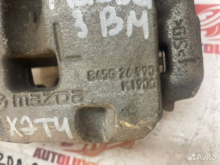 Суппорт тормозной задний левый Mazda 3 BM хетчбек