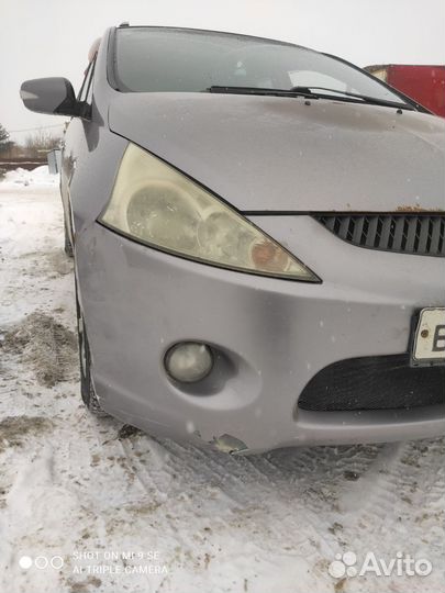 Бампер с птф передний Mitsubishi Grandis